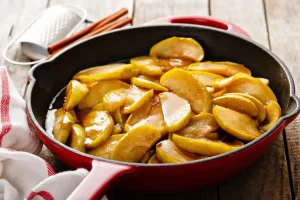 Sauté apple slices in medium heat